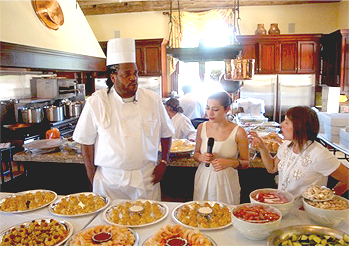 Rick Johnson, owner and operator 
            of Metro City Wings catering, being interviewed at P. Diddy's All White 4th of July event, he was hired to cater.