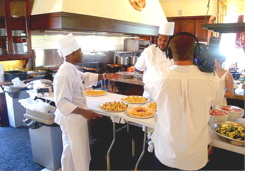 Rick Johnson being filmed in the 
            Kitchen at P. Diddy's All White 4th of July event.